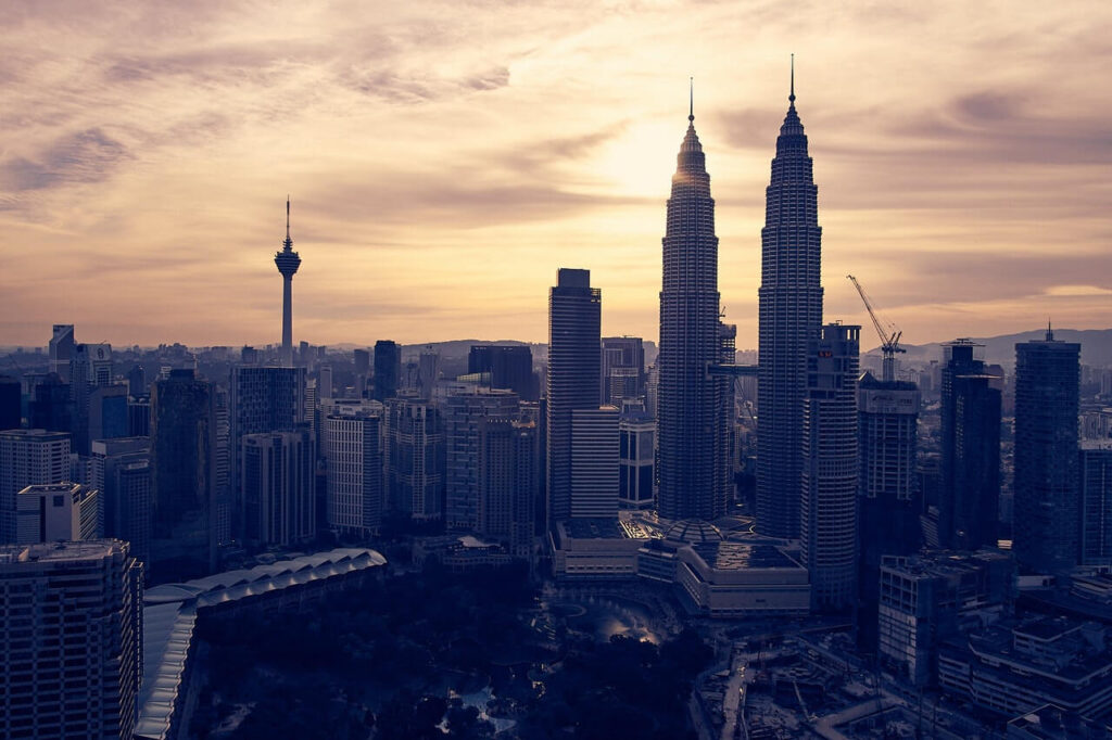 KLCC and KL tower overlooking the sunset in Malaysia.