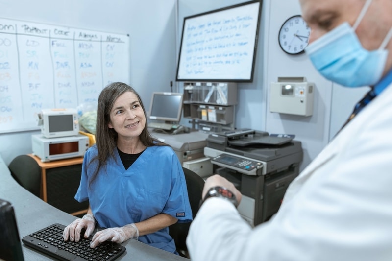 A nurse typing 