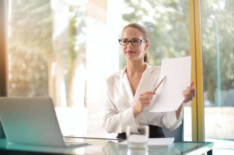 A woman who studied abroad showing her credentials and skills to employees. 